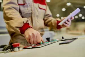 closeup-worker-using-automated-machine-woodworking-production-facility_637285-12043